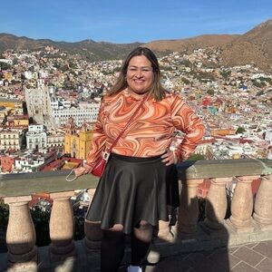 Vibrant Orange Long Sleeve Tee with Swirling Pattern